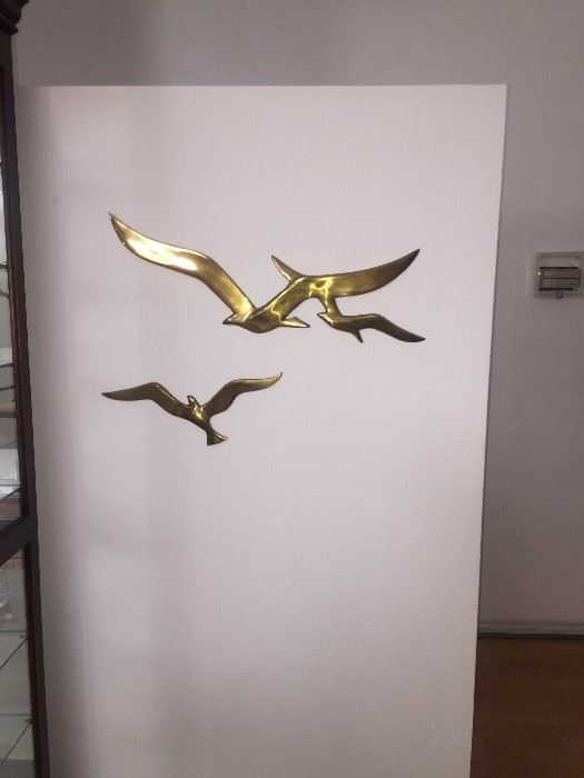 Stylish hanging brass sculpture....Beautiful and super Mod. We have many