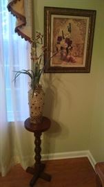 Nice fern stand and one of the many pictures. Several flower arrangements scattered throughout the house.