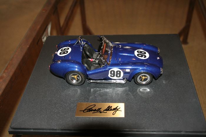 Signed plaque by Shelby on this Die-cast model car
