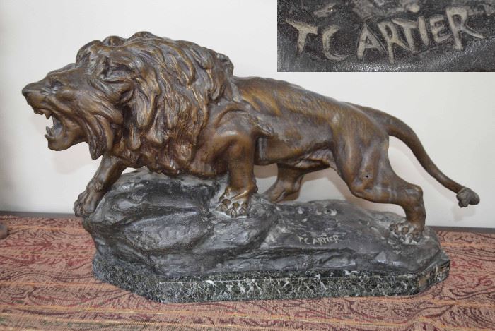 signed T. Cartier bronze lion figure;