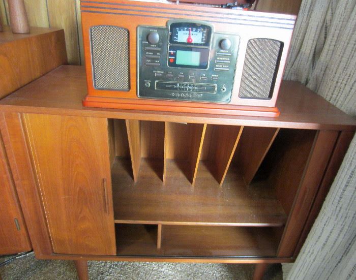 Crosley, record, CD, cassette, and radio player (can record onto CD).  Shown on top of Record cabinet with tambour doors attributed to Kai Kristiansen 