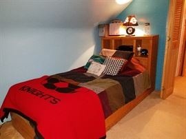 Twin bed with bookcase headboard. Bedding sold separately.