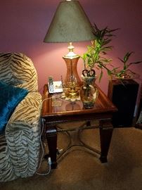 Glass-topped end table and glass lamp.
