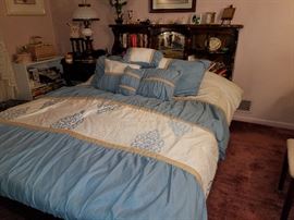 King-sized waterbed with platform and bookcase headboard