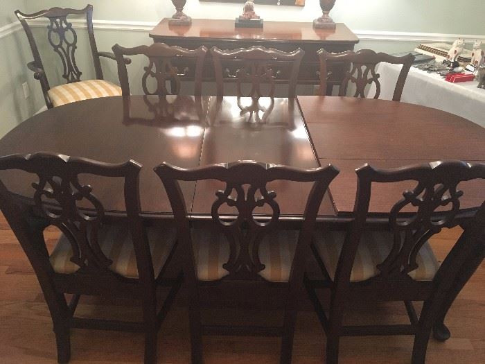 Ethan Allen Dining Room Table with 8-chairs, two leaves and table pads. Dimensions of table 66" long, 44" wide, 29" tall. Leaves are 18" long each, so table can be 66", 84" or 102" long. 