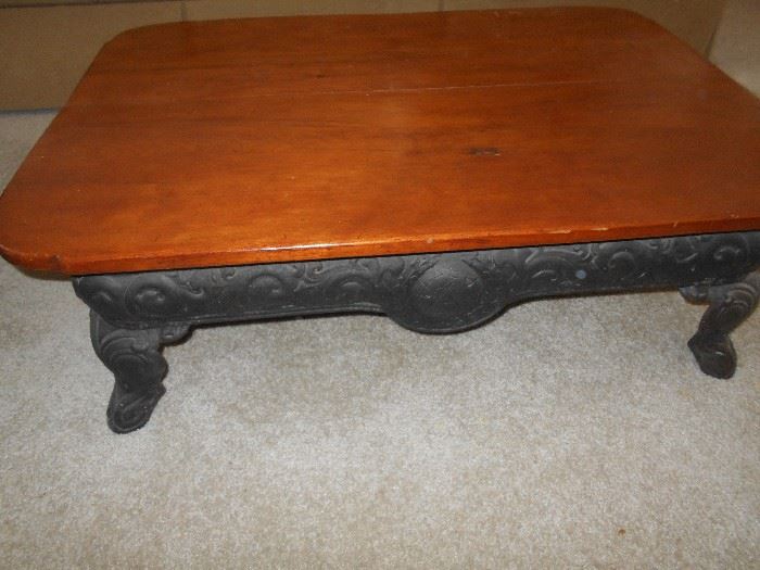 RE-MADE ANTIQUE MAPLE COFFEE TABLE WITH AN OLD STOVE BASE. VERY COOL 