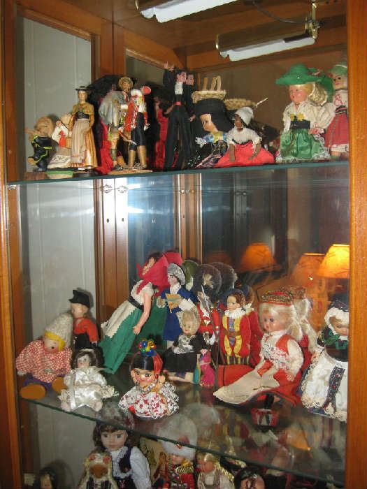 many small dolls from around the world