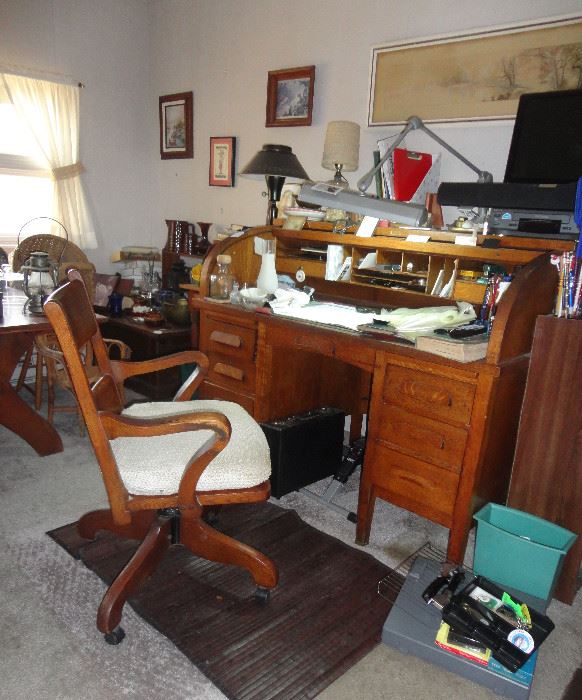 C Curve roll top desk and antique office chair.