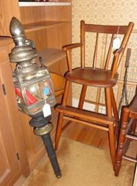 Child's high chair and antique coach lamp.