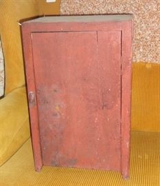 Small cupboard with original red paint.