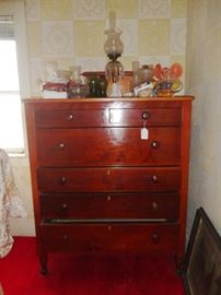 More oil lamps standing atop handsome six drawer chest - it has original wood knobs.
