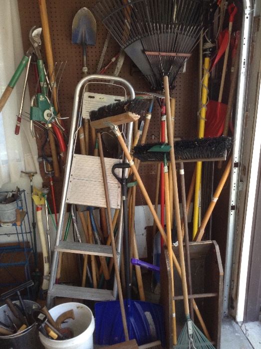 Garage with yard tools.
