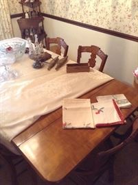 Dining room table and linens.