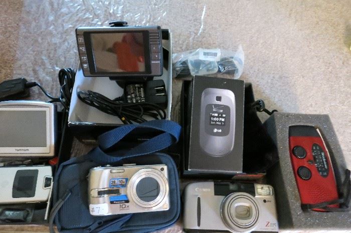 A Nice Selection Of Small Electronics  Of Cameras, Emergency Radio, GPS, Wireless Phone