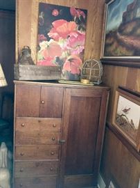 Antique oak wardrobe is a great functional piece for an office, craft room or kitchen/dining room. Note the pieces of art -- including a moody oil landscape and a piece featuring a pair of quail.