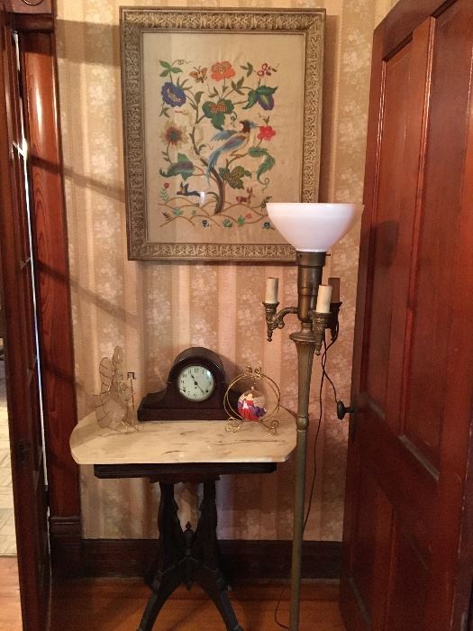 Vintage framed  floral crewel piece   Hangs above in Eastlake table and  vintage mantle clock .