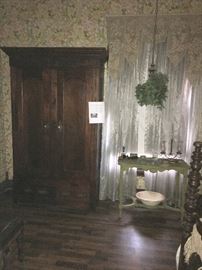 Green-painted washstand is next to very fine antique armoire/wardrobe. Attached is the providence of this wardrobe that came from a plantation