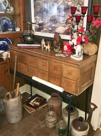 Vintage 12 drawer filing cabinet from the esteem to camp Fern with provenance . Some of the large collection of jugs are seen here below it. Vintage rotary phone is on top, along with porcelain horse collection. A large framed watercolor hangs above signed and numbered