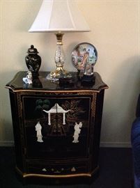 Waterford Lamp atop an oriental two-door chest with inlaid pearl