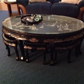 Oriental cocktail table with six stools
