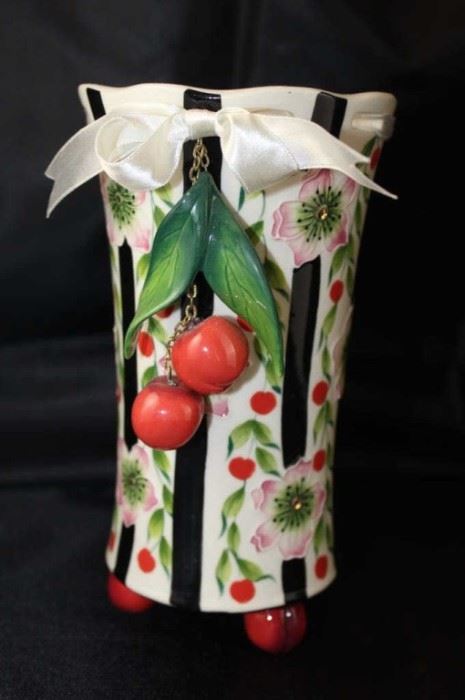 McCall J. Icing on the cake, 7.5" footed cherry vase with ribbon top.
