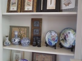 assorted oriental plates, vases, and prints