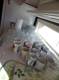 assorted mugs, and glassware