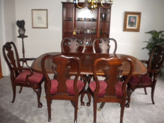 Drexel Travis Court 51″ Bow FrontChina Cabinet & Ethan Allen 18th Century Mahogany Dining Table with banded parquetry & The feet are capped with solid brass.