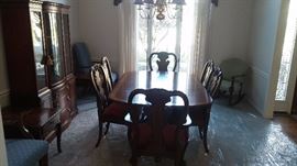 Drexel Travis Court 51″ Bow Front China Cabinet & Ethan Allen 18th Century Mahogany Dining Table with banded parquetry & The feet are capped with solid brass.