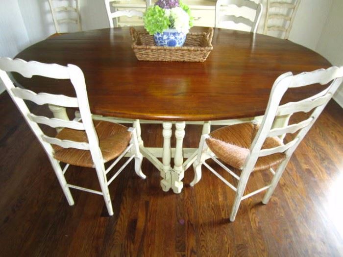 Drop leaf gate leg Dining or Kitchen table.  There are 6 ladderback chairs available separately.