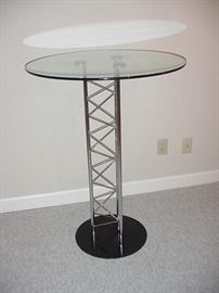 Tall contemporary table with black base and chrome pedestal