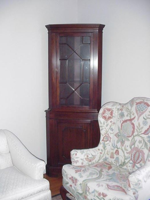 Mahogany corner cabinet; wing chair