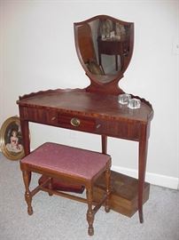 1940s mahogany vanity with shield shaped mirror