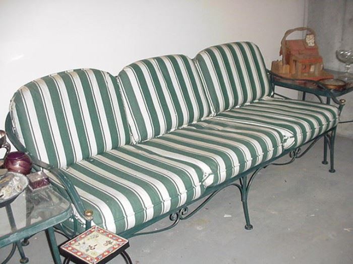Three seat wrought iron sofa for porch or patio, part of a larger set