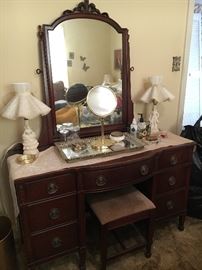 Vintage mahogany vanity with mirror and bench, vintage man and woman lamps, vanity tray and mirror.