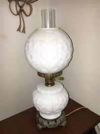Vintage lamp with light in base.