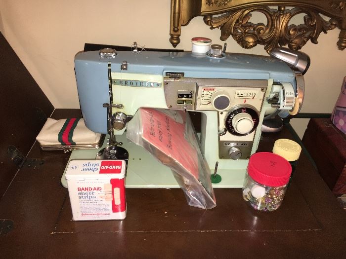 Vintage Brother sewing machine with cabinet.