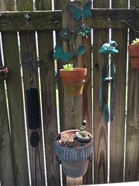Lots of outdoor decor, garden items and fence hangers.