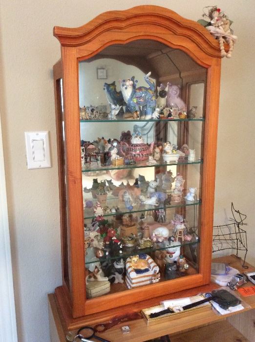 Collection of cats, curio cabinet