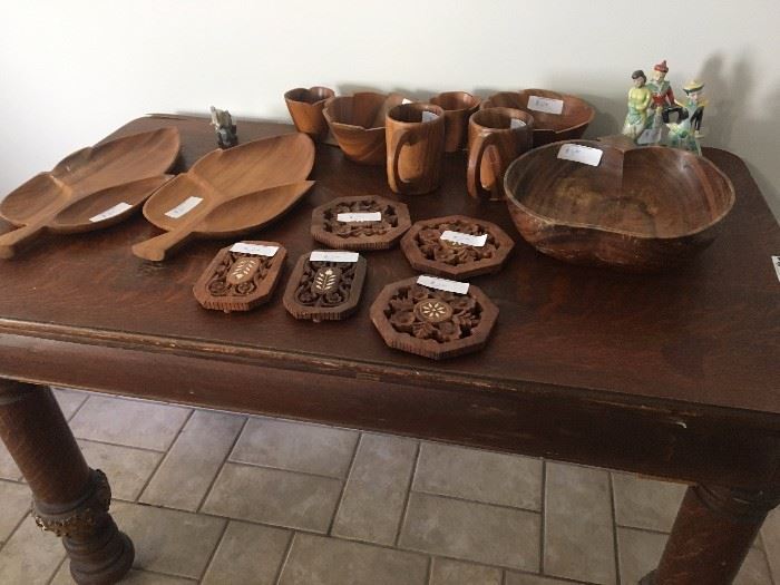 Vintage wooden table with carved wood dining implements