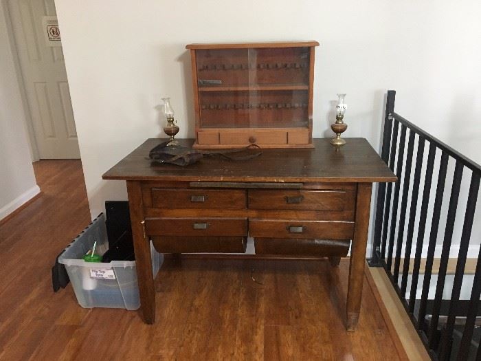 Vintage desk with unique bottom drawers, pair or small oil lamps, display cabinet