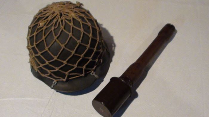 Replica WWII Nazi helmet and hand grenade.1 of 5