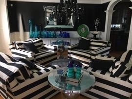 Elegance abounds in a casual setting! Chrome tables, brilliant art glass and virtually brand new over-stuffed arm chairs.