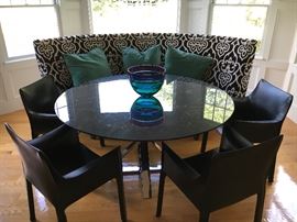 This luxury dining table features a chrome base and a beautiful, huge slab of black and white marble.  The Mario Bellini Leather cab chairs are in perfect condition and add such elegant style. 