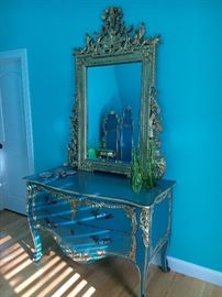 French Provincial, painted aqua with gold leaf.
