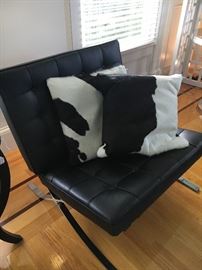 Barcelona Chair - Black Leather and Chrome. Wicked cool animal skin pillows.