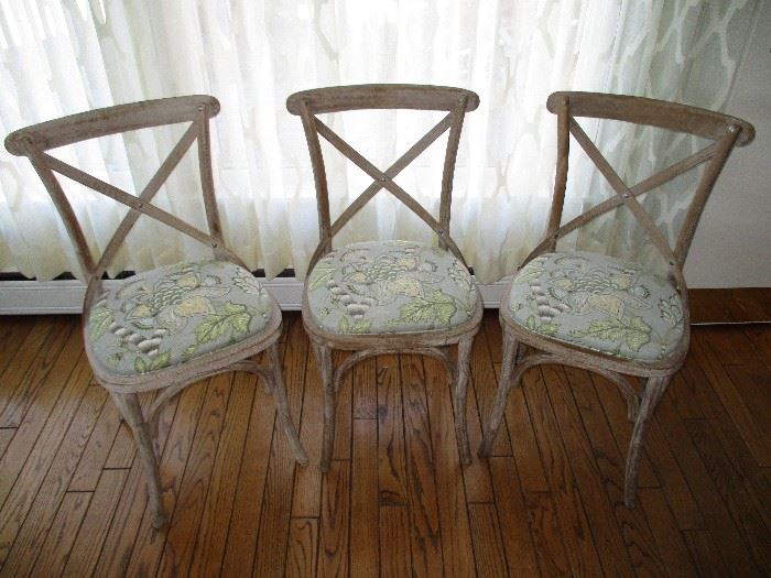 Three Restoration Hardware dining chairs with custom upholstered seat cushions