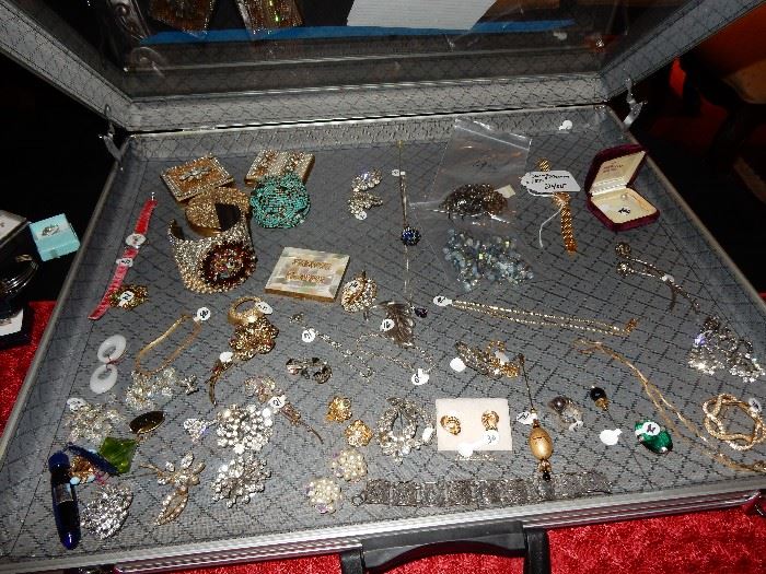 Table of costume jewelry, plus a Mokimoto Pearl Tie Tack, 18 K Baume and Mercier watch, and other fine pieces