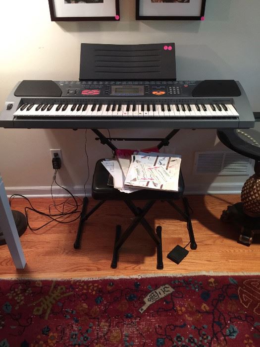casio keyboard, chair, pedal and music stand