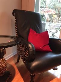 Fantastic leather and zebra materials with silver colored brads. A pair of chairs for sale.